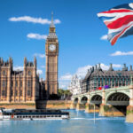 Big Ben and Houses of Parliament with boat in London, UK